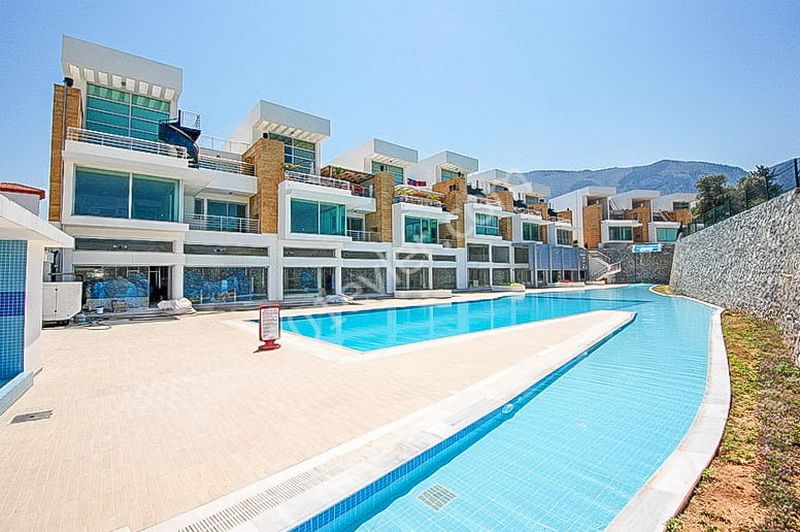 Duplex apartment for sale in Dogankoy with 2 bedrooms + swimming pool + semi-furnished + white furnished + air conditioning ** 