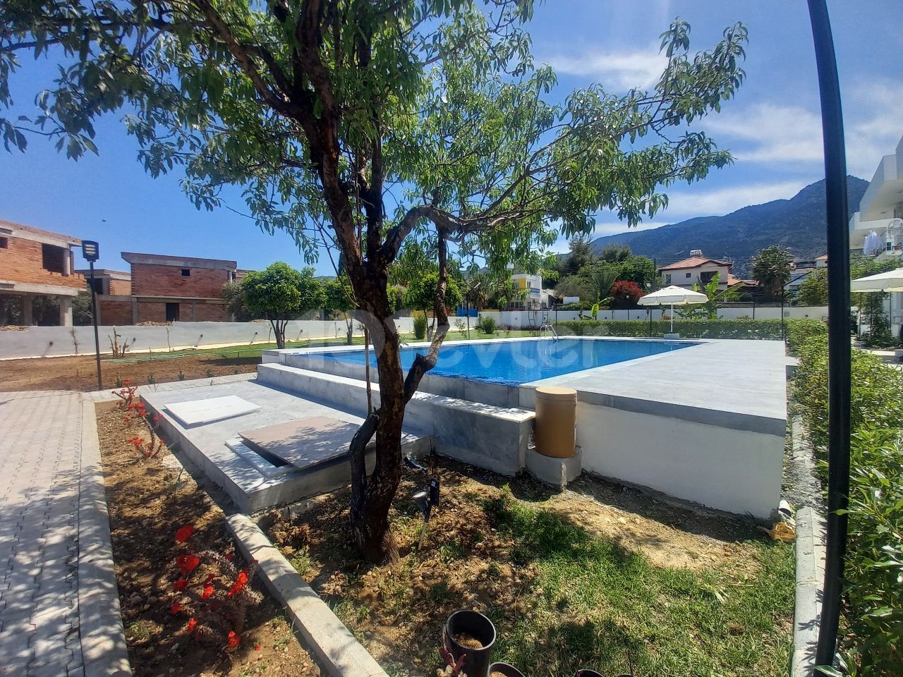 Luxury brand new 2 bedroom ground floor apartment in a small development - communal pool and garden 