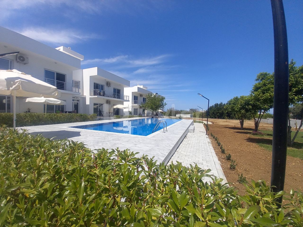 Luxury brand new 2 bedroom ground floor apartment in a small development - communal pool and garden 