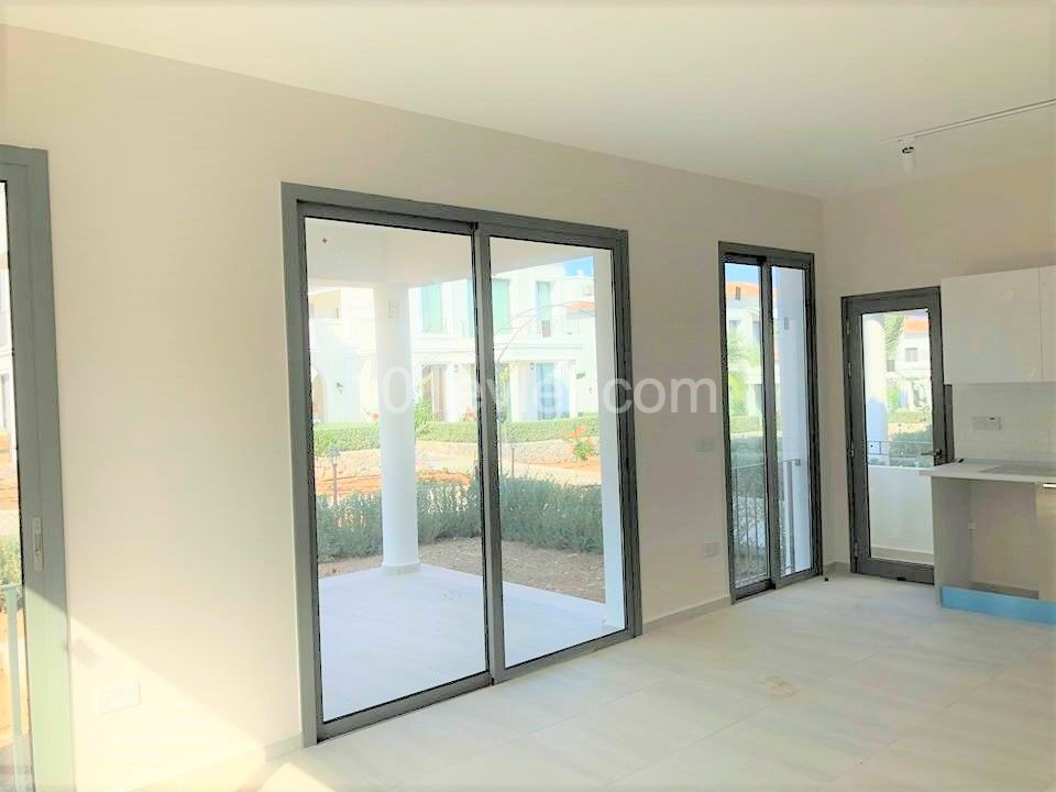 THE MOST PRESTIGIOUS SITE IN KYRENIA ALSANCAK IN CYPRUS OFFERS A GARDEN FLOOR APARTMENT ** 