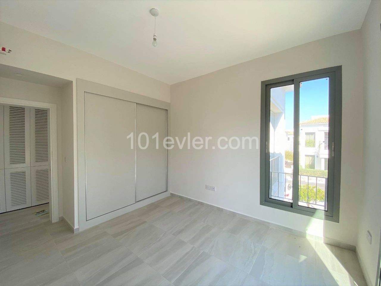 TOP FLOOR APARTMENT IN TOWN HOUSES, THE MOST PRESTIGIOUS SITE OF ALSANCAK IN KYRENIA, CYPRUS ** 