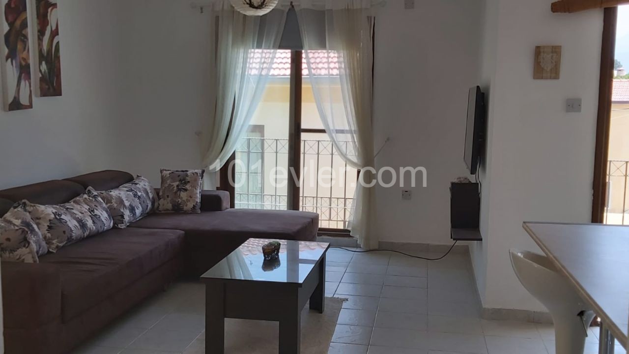 Two-bedroom furnished penthouse for sale  in Doanköy, Girne in a complex with a swimming pool