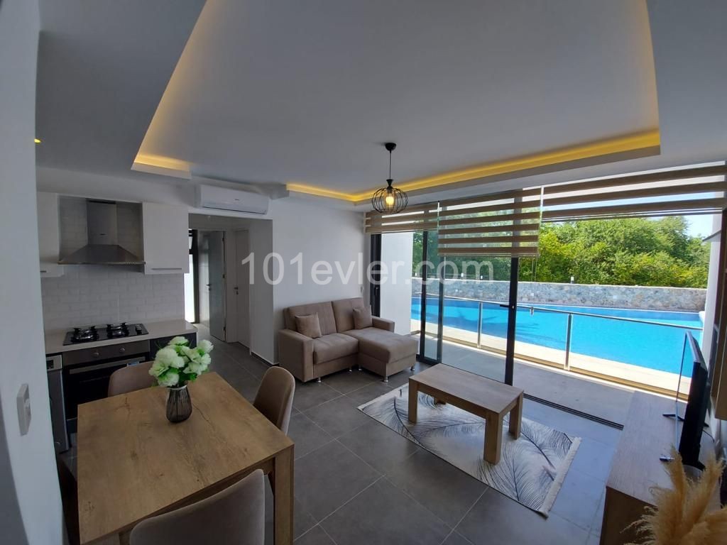 2+1 penthouse or garden apartment for sale in a complex with pool in Lapta area, Girne.