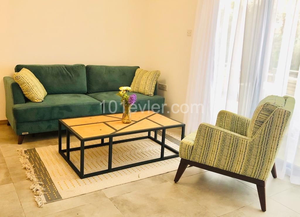 1+1 Luxury apartment with garden for rent in Alsancak, in a complex with pool