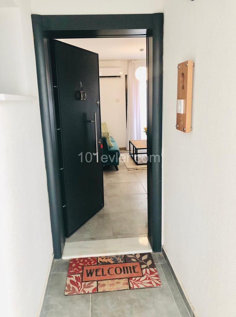 1+1 Luxury apartment with garden for rent in Alsancak, in a complex with pool