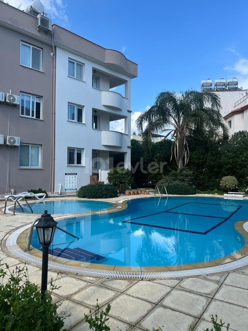 IN ALSANCAK 1+1 FULLY FURNISHED NEW APT WITH WIDE BALKONY AND COMMON SWIMMING POOL