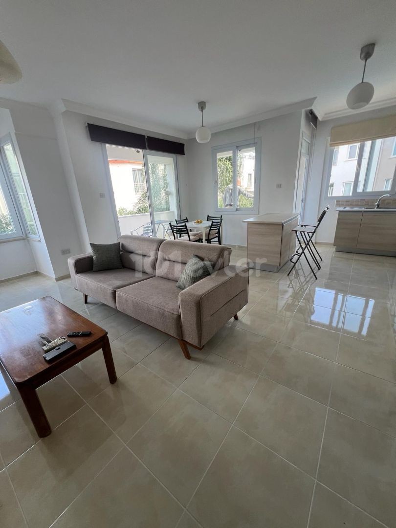 IN ALSANCAK 1+1 FULLY FURNISHED NEW APT WITH WIDE BALKONY AND COMMON SWIMMING POOL