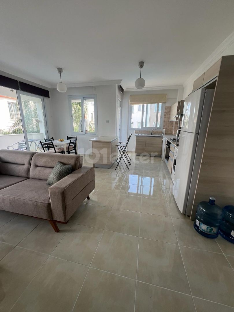 IN ALSANCAK 1+1 FULLY FURNISHED NEW APT WITH WIDE BALKONY AND COMMON SWIMMING POOL