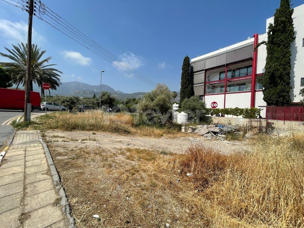 A land plot for sale with a project of a Decommissioned apartment and a shop on the highway as well as sushico in the center of Kyrenia ** 