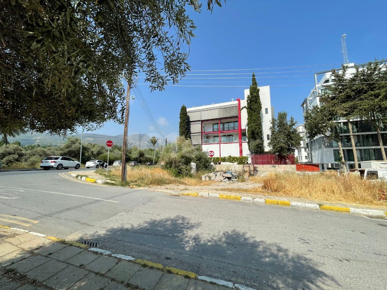 A land plot for sale with a project of a Decommissioned apartment and a shop on the highway as well as sushico in the center of Kyrenia ** 