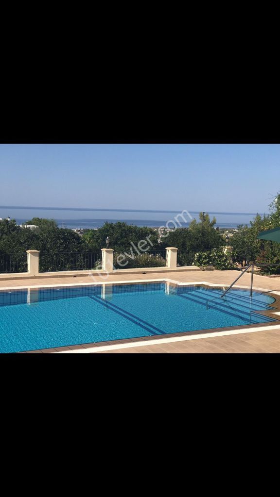 950m2 with magnificent mountain and sea views in Çatalköy. this magnificent villa with 5 bedrooms and a swimming pool in 3.5 acres of land, the view of which is never closed ** 