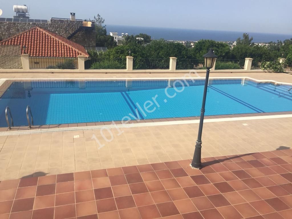 950m2 with magnificent mountain and sea views in Çatalköy. this magnificent villa with 5 bedrooms and a swimming pool in 3.5 acres of land, the view of which is never closed ** 