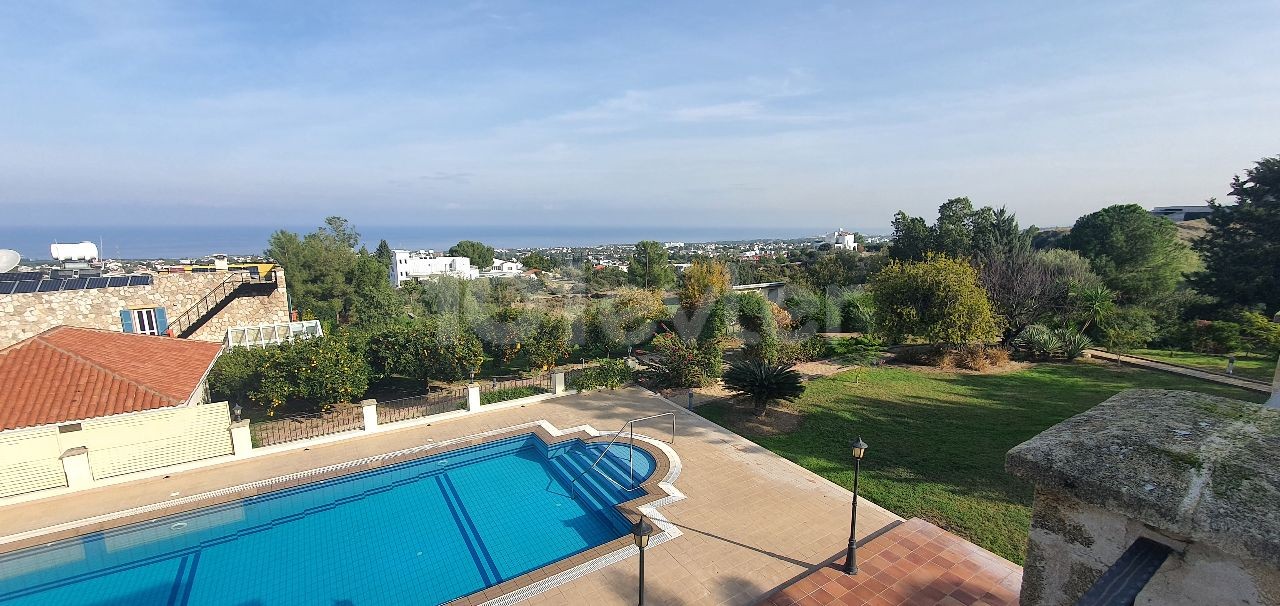 950m2 with magnificent mountain and sea views in Çatalköy. this magnificent villa with 5 bedrooms and a swimming pool in 3.5 acres of land, the view of which is never closed ** 