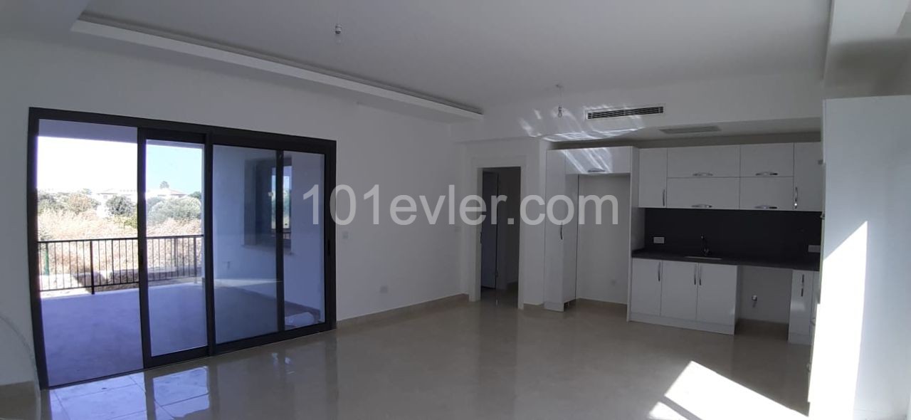 Kyrenia city center is a 4-minute drive away. 2 and 3 bedroom apartments integrated with quality workmanship in a quiet location in the olive grove.(On the ground and terrace floor) ** 