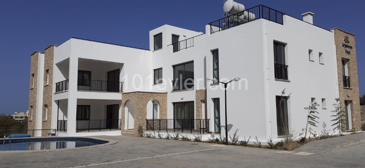 Kyrenia city center is a 4-minute drive away. 2 and 3 bedroom apartments integrated with quality workmanship in a quiet location in the olive grove.(On the ground and terrace floor) ** 