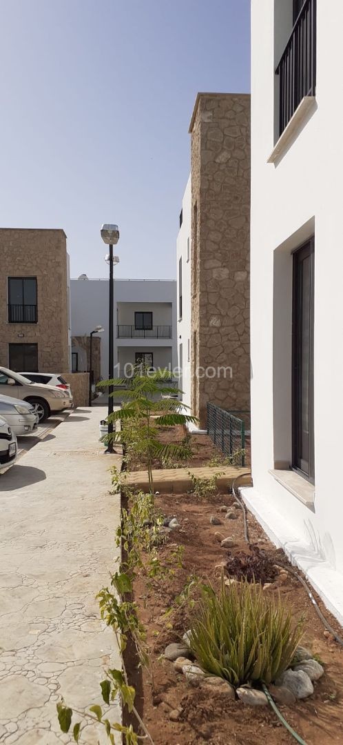 Kyrenia city center is a 4-minute drive away. 2 and 3 bedroom apartments integrated with quality workmanship in a quiet location in the olive grove.(On the ground and terrace floor) ** 