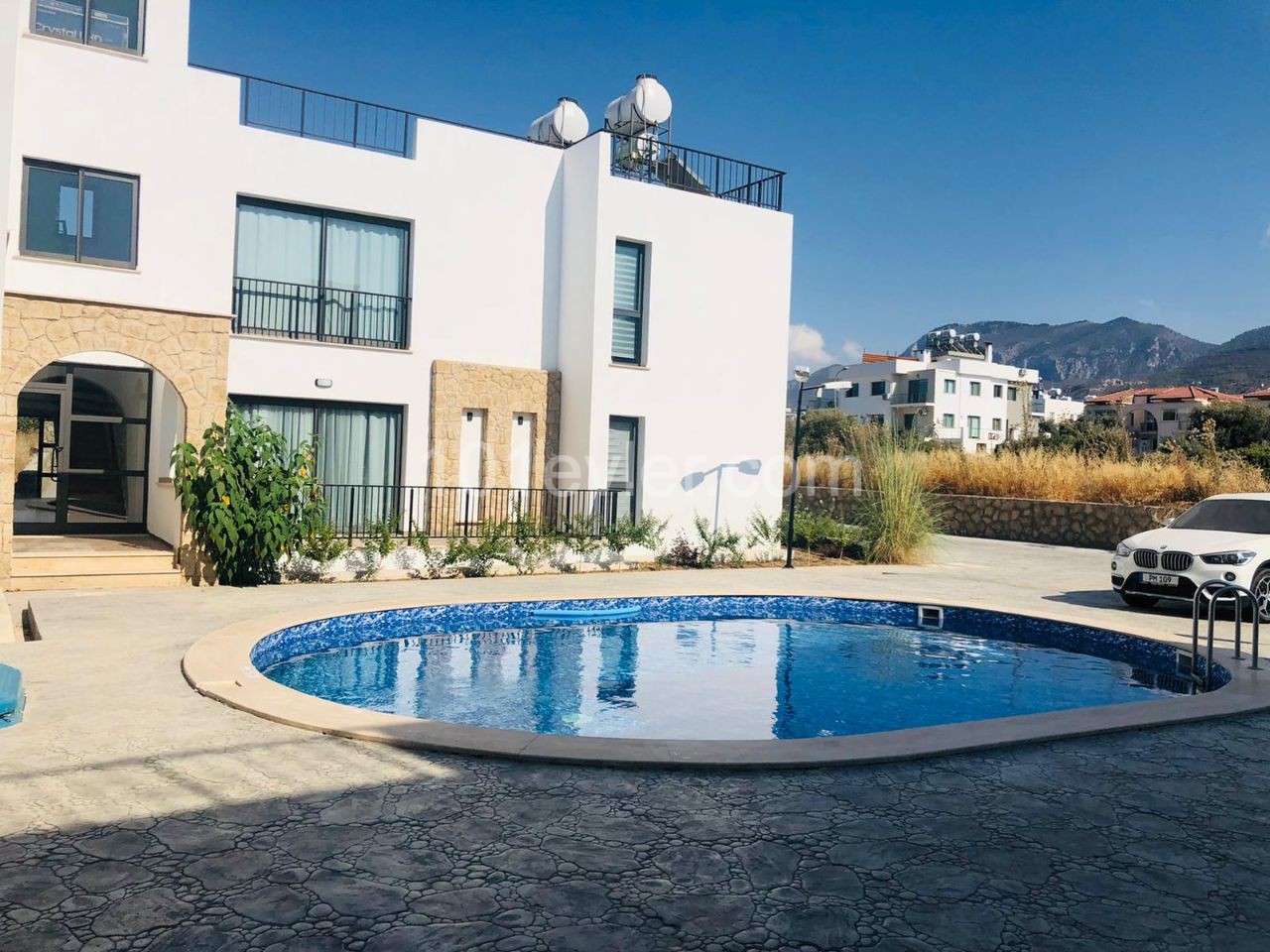 Kyrenia city center is a 4-minute drive away. 2 and 3 bedroom apartments integrated with quality workmanship in a quiet location in the olive grove.(On the ground and terrace floor) ** 