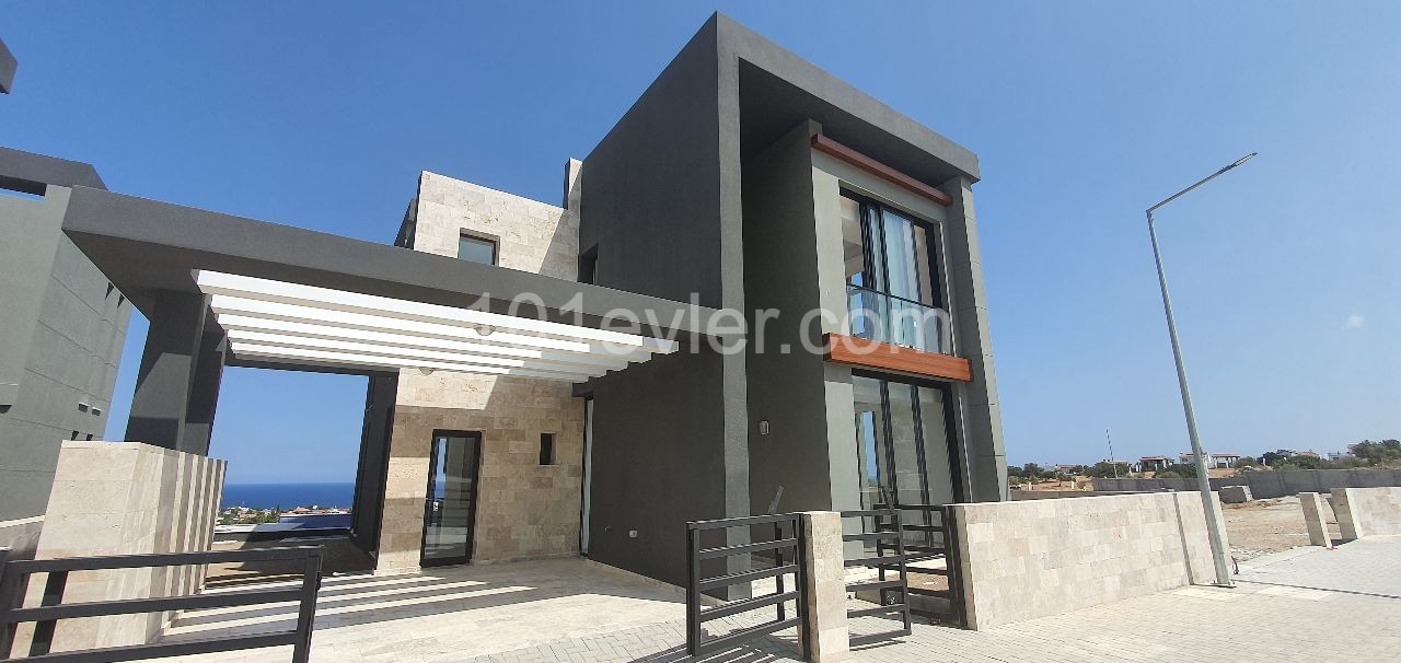 Kyrenia Escape Beach area 4+1 detached villa.Full sea view, pool view...(Equivalent Title Deed)Finished 275,000 STG, they will be finished after 1 year 250,000 STG ** 