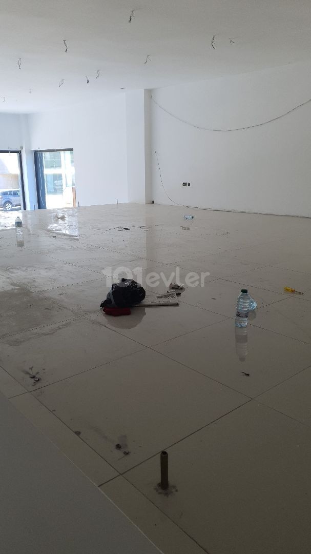 A commercial shop with a 100m2 entrance, 75m2 without parking space on the busiest street in Kyrenia is for rent. ** 