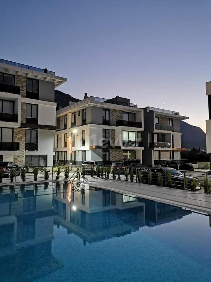 Kyrenia Lapta Babylonian Gardens area, all taxes paid, ground floor garden apartment on a site with a pool of 70 m2. Central heating cooling,24-hour hot water, very spacious apartment..500 meters from the beach.ALSO 2+1 90.000 stg +VATavilable ** 