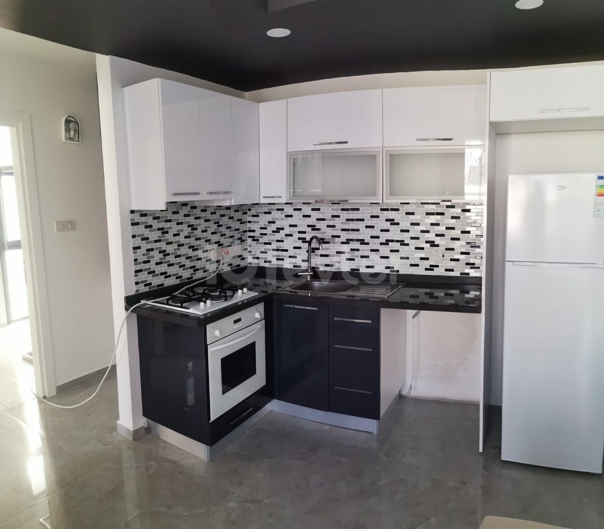 Kyrenia Lapta Babylonian Gardens area, all taxes paid, ground floor garden apartment on a site with a pool of 70 m2. Central heating cooling,24-hour hot water, very spacious apartment..500 meters from the beach.ALSO 2+1 90.000 stg +VATavilable ** 