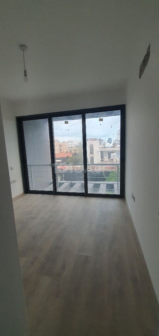 2+1 luxury flat in the center of Kyrenia, Turkish Hearth Club and Barbaroslar market area in a brand new building. VAT unpaid