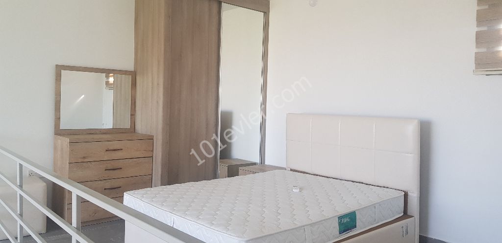 Girne Üniversitesi'ne yürüyüş mesafesinde 1 yatak odalı yeni bina yeni eşyalı kiralık .. 0533 871 14 90