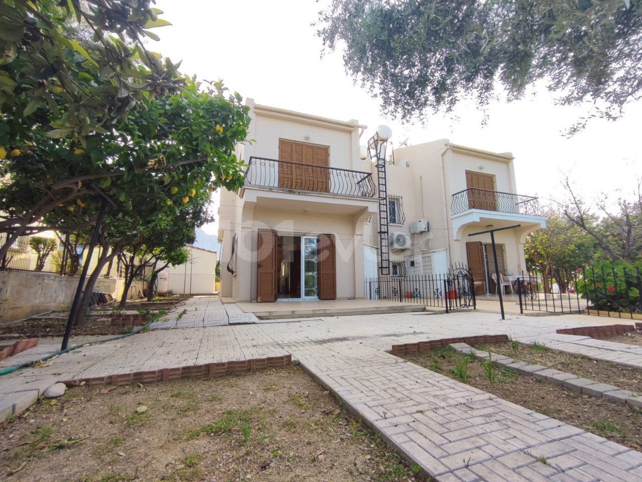 Girne, Karaoglanoglu | Private Garden | Covered Garage | Well-Maintained 3+1 Villa for Sale | Shared Pool ** 