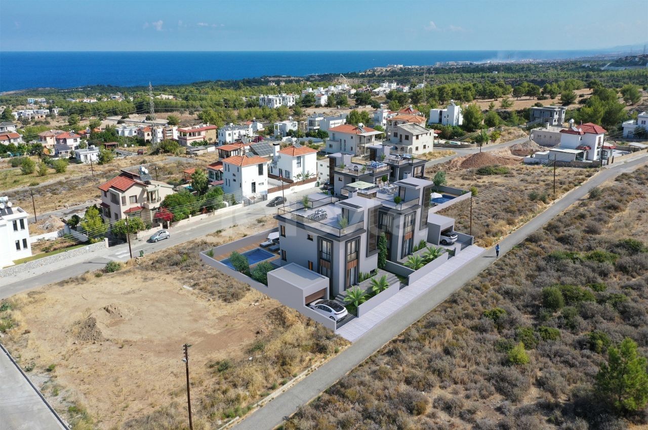 High-rise villas with mountain and sea views and private pools in Çatalköy.