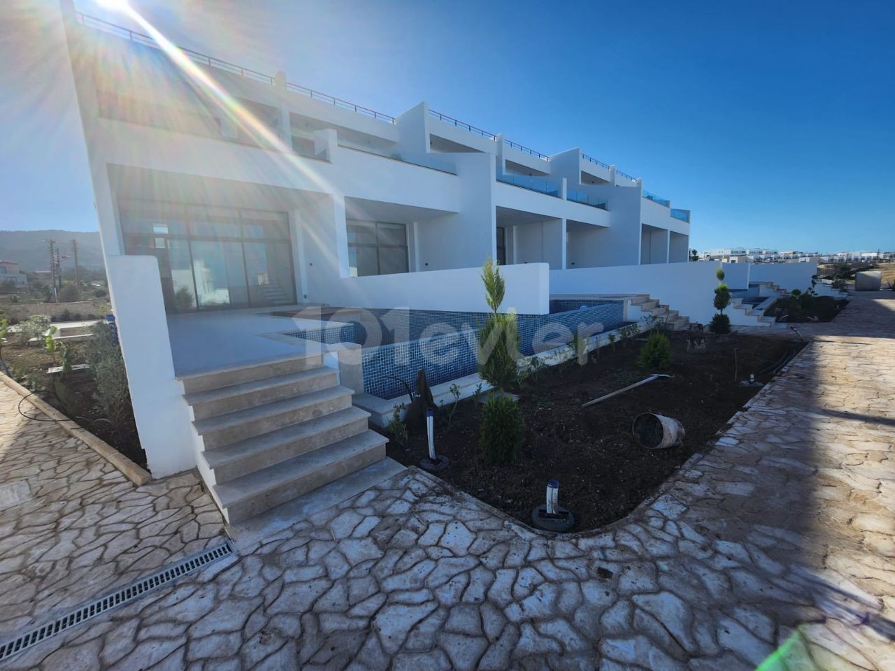 3+1 loft with garden for sale in a site with a private beach