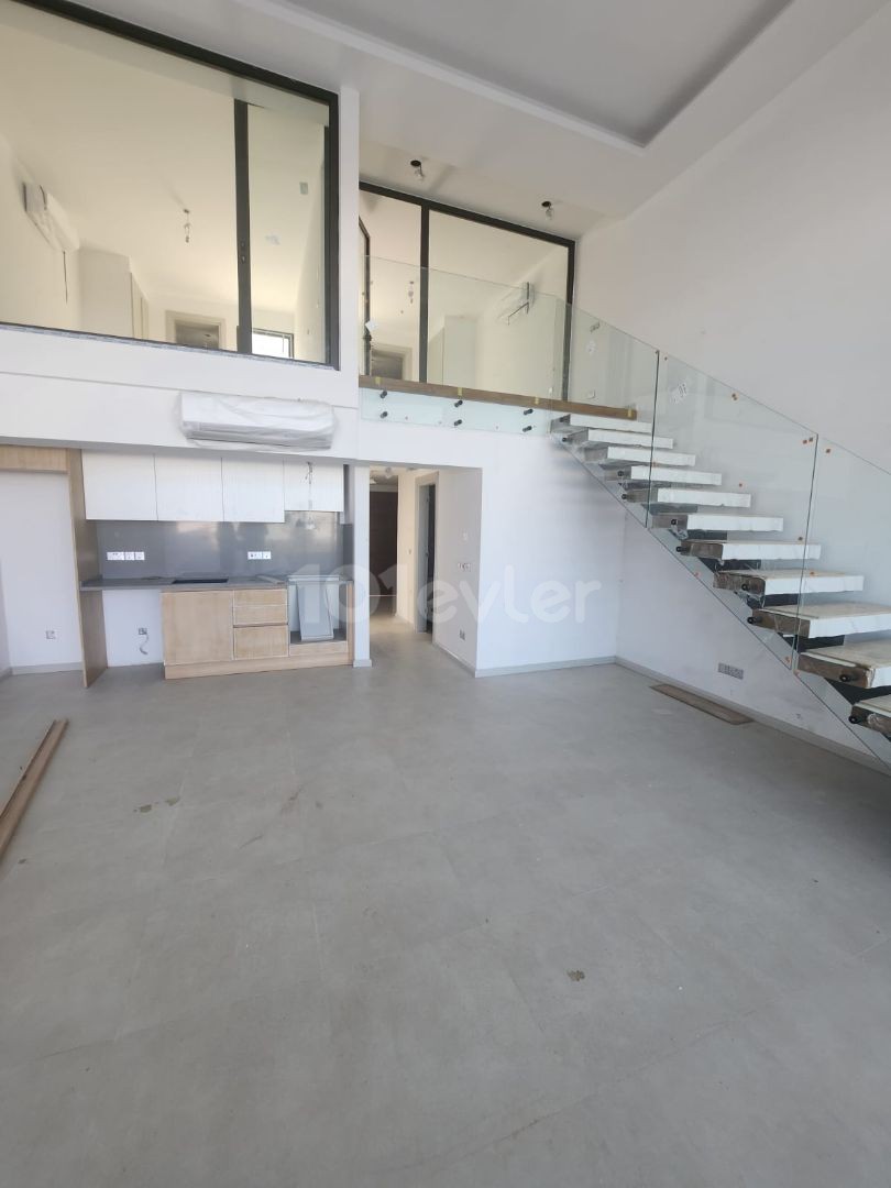 3+1 loft with garden for sale in a site with a private beach