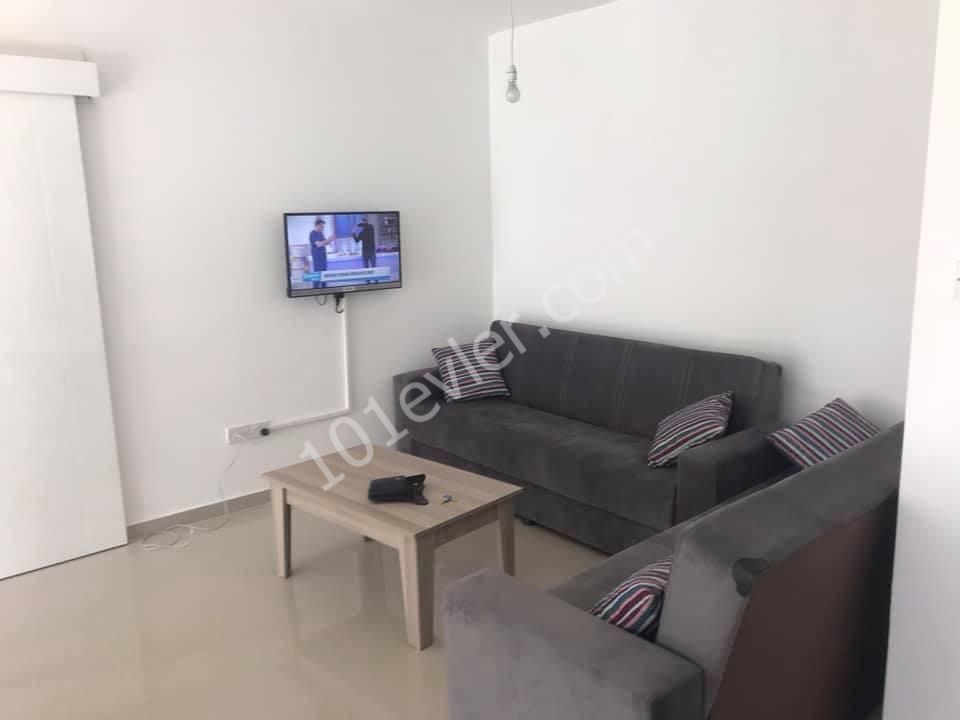 Girne Merkez'de 2+1 kiralık yeni apartman dairesi. 05338445618