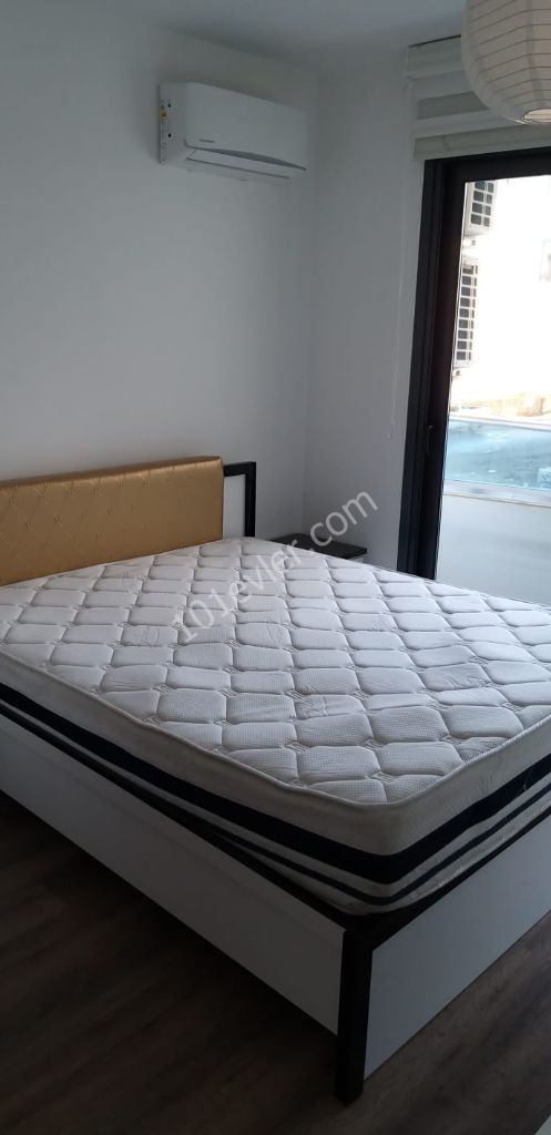 girne merkezde lüks, asansörlü ve kapalı otoparklı rezidansta güvenlikli, lüks eşyalı 2+1 daire 05338445618