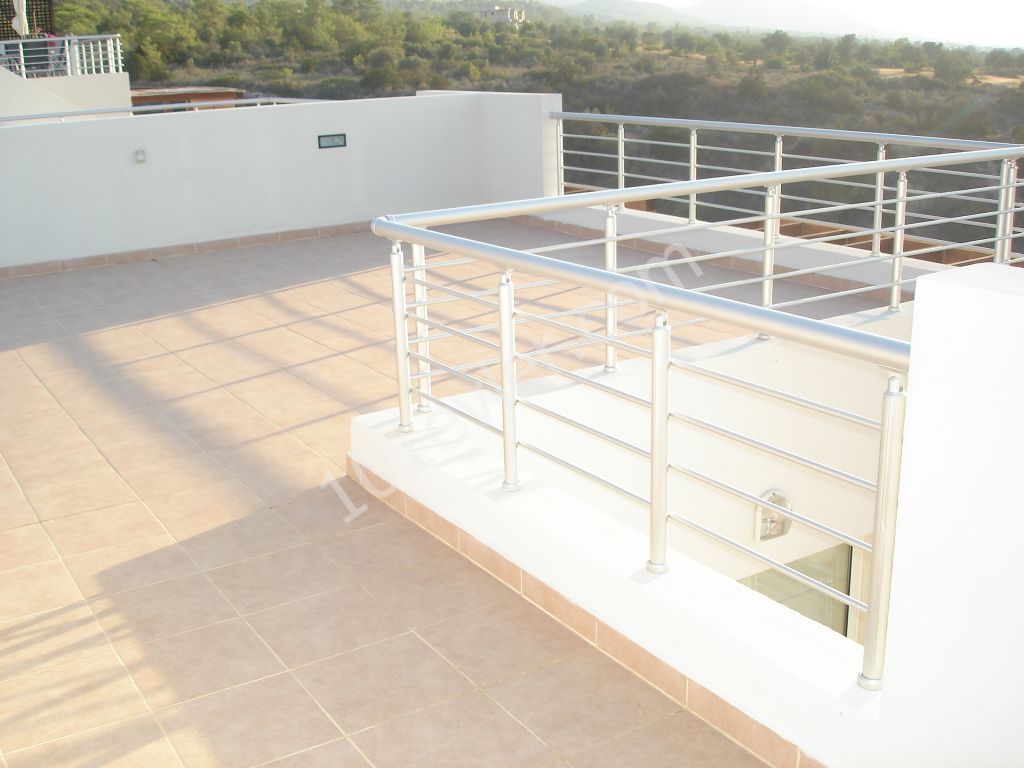 Two Bedroom Top Floor Apartment with Private Roof Terrace in Tatlısu near Magusa. Ref: TU539