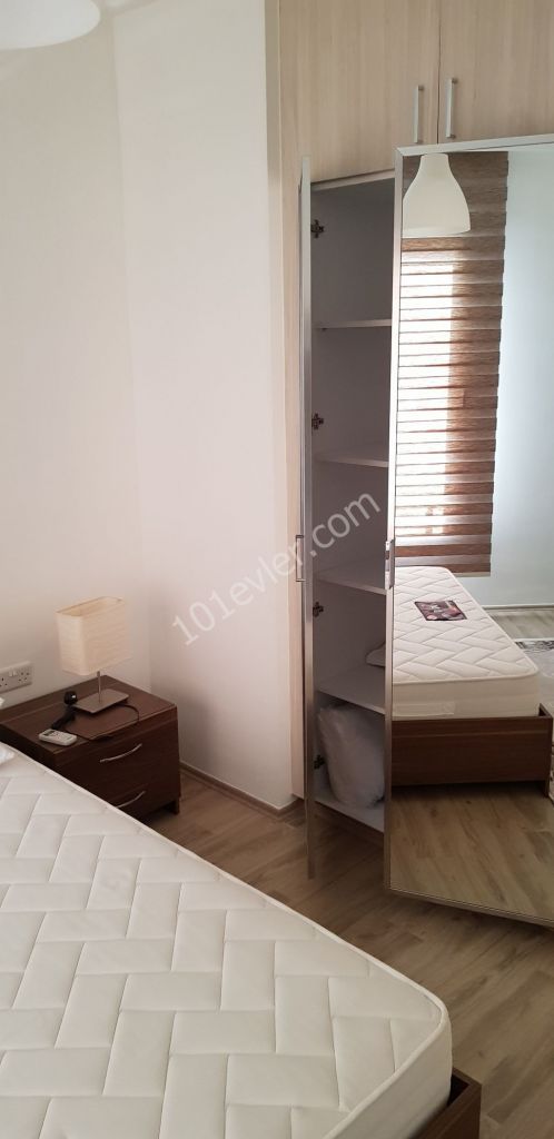 GİRNE MERKEZ'DE LÜKS SİTE İÇİNDE FULL EŞYALI  SATILIK DAİRE