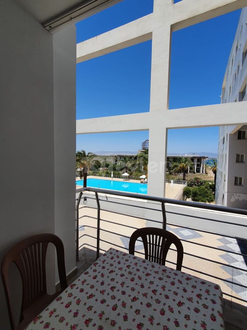 3+1 apartment with shared pool near the sea