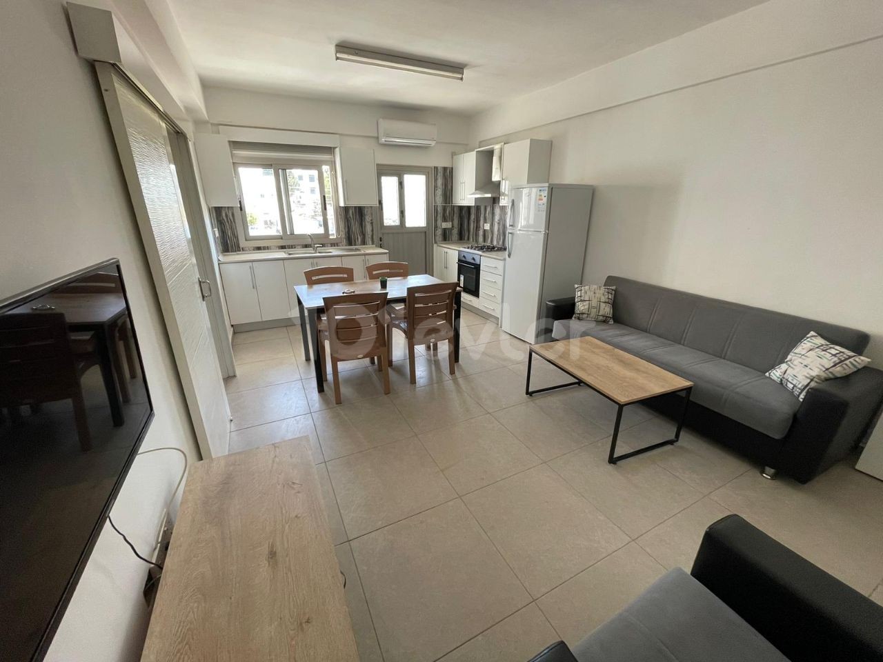 AN UNMISSABLE INVESTMENT OPPORTUNITY WITH ITS TENANT IN A NEW GROUND-FLOOR APARTMENT WITH A TOTAL OF TWO FLOORS OF GARDEN 50 METERS FROM THE MAIN STREET IN NICOSIA HAMITKOY ** 