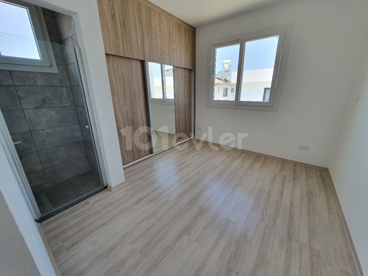 IN A QUIET AND PEACEFUL NEIGHBORHOOD OF 127M2 CONSISTING OF 4 APARTMENTS ON 2 FLOORS IN TOTAL IN MITRELI YEŞILADA DISTRICT 3 + 1 LUXURY APARTMENTS WITH ALL TAXES PAID WITH THEIR OWN LARGE TERRACE SECTION ** 