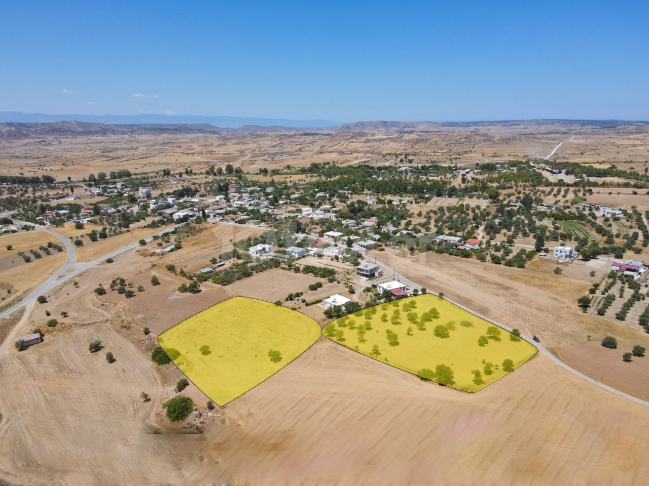 OUR FIELD, WHICH HAS A TOTAL OF 9 ACRES OPEN FOR CONSTRUCTION IN THE VILLAGE OF SHIRINEVLER IN KYRENIA, CONSISTS OF 2 SEPARATE COBS OF 5 AND 4 ACRES.THE OFFICIAL ROAD (12,000 STG PER ACRE) ** 