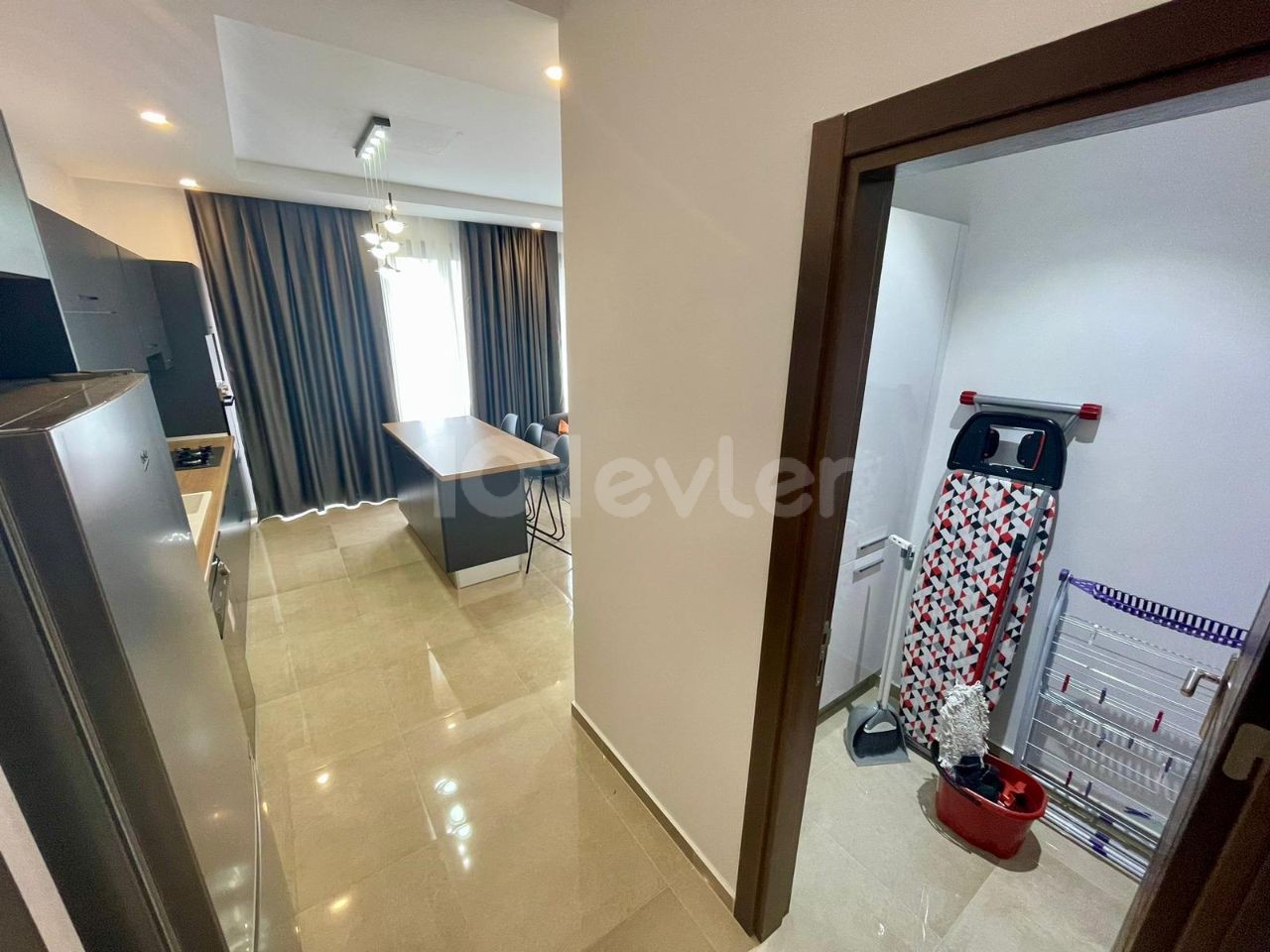 FOR THOSE LOOKING FOR A LOW FLOOR. .  FULLY FURNISHED LUXURIOUS 2+1 APARTMENT WITH ATTRACTIVE ADVANTAGES SUCH AS AIR CONDITIONING IN EVERY ROOM, LARGE SCREEN LCD TV, LAUNDRY ROOM, PARKING LOT, COMMUNAL POOL, WHICH EXHIBITS A UNIQUE BLUE AND GREEN VIEW TOGETHER, CLOSE TO THE CITY LIFE IN THE OLIVE GI