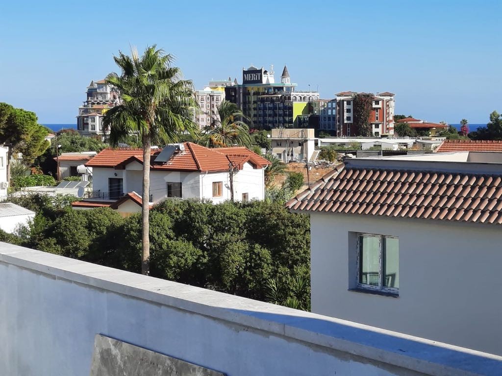 WOHNUNGEN MIT GARTEN UND TERRASSE MIT MEERBLICK ZUM VERKAUF IN KYRENIA ALSANCAK MERIT ROYAL