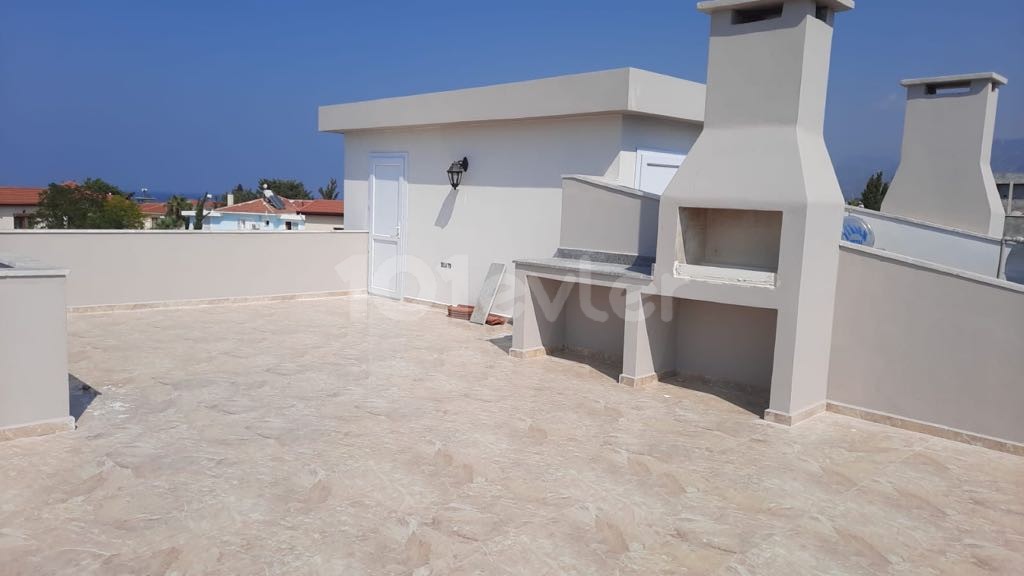 WOHNUNGEN MIT GARTEN UND TERRASSE MIT MEERBLICK ZUM VERKAUF IN KYRENIA ALSANCAK MERIT ROYAL