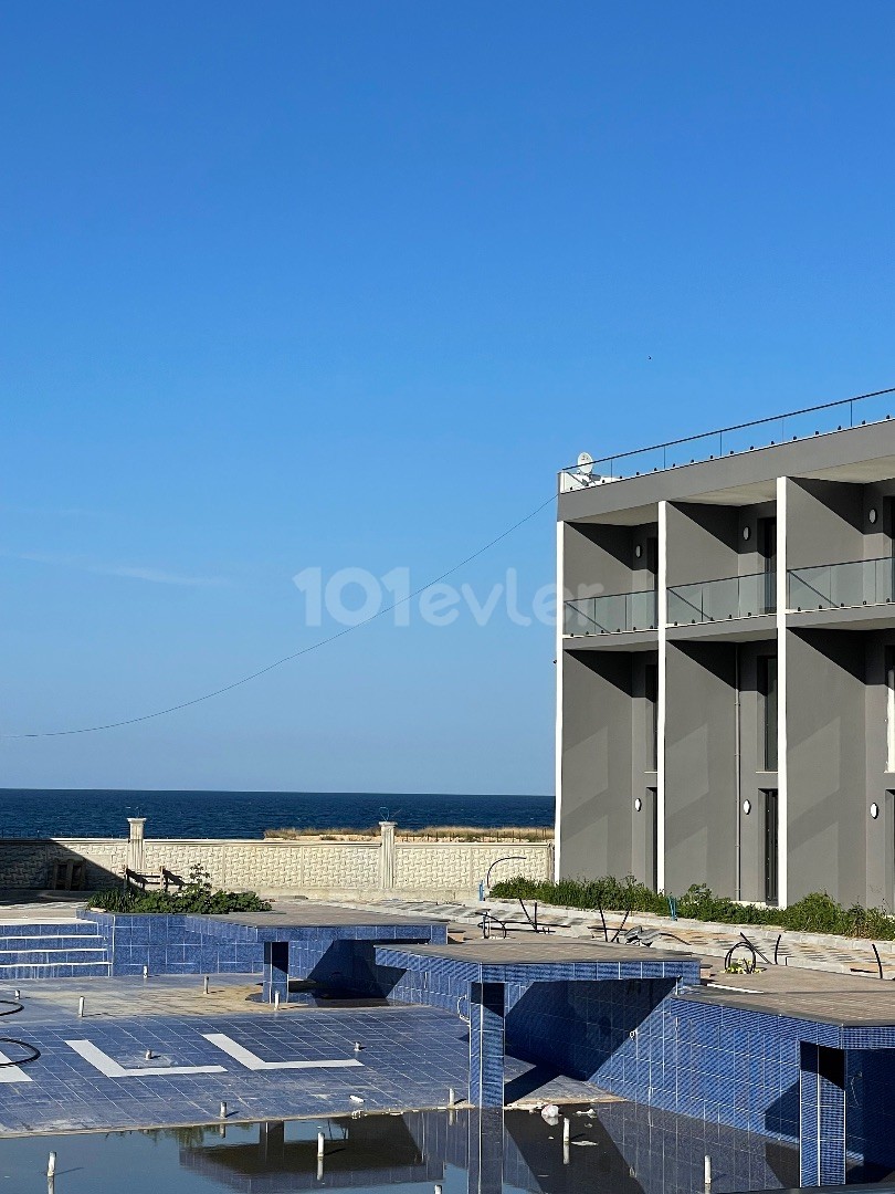 READY 2+1 LOFT APARTMENT 100 METERS FROM THE SEA in New project Olivia Court