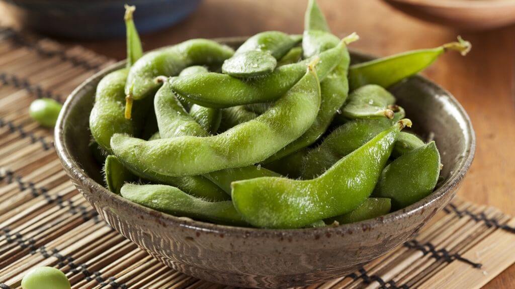 Salted edamame in a wooden bowl