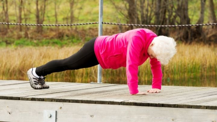 Senior woman working out in the park