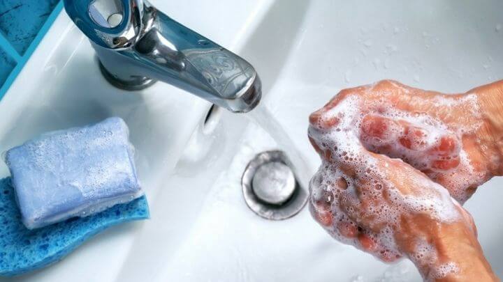 Men washing his hands