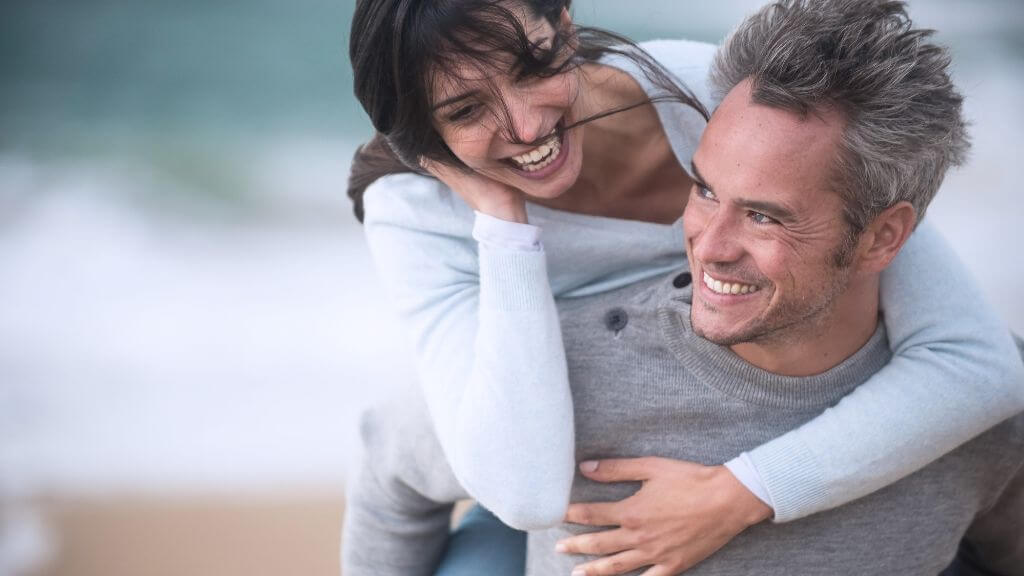 a man and a woman smiling