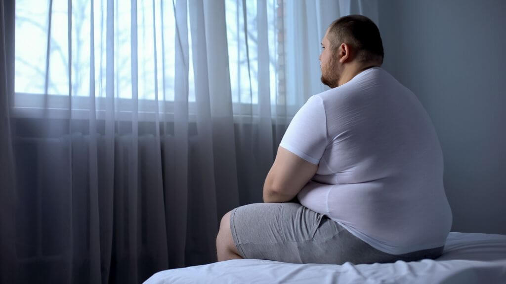 a person sitting on a bed