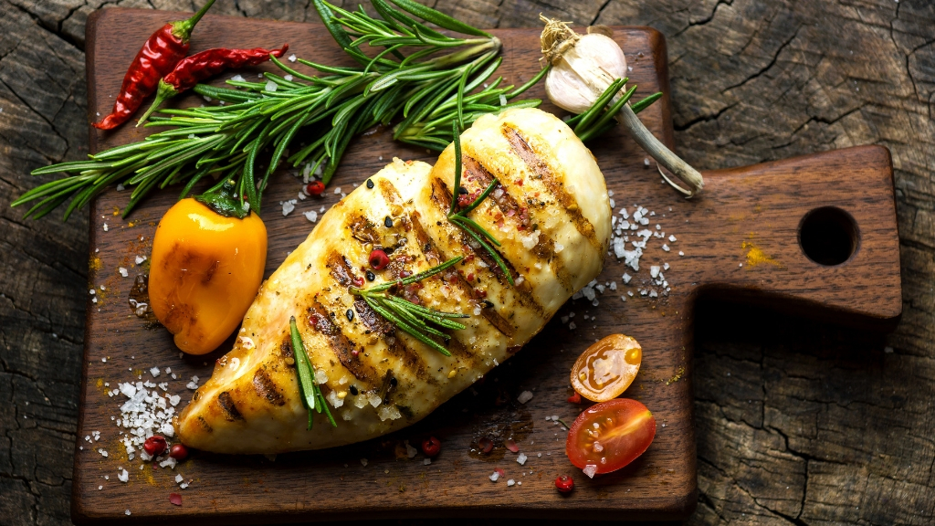 Grilled chicken breasts with fresh rosemary