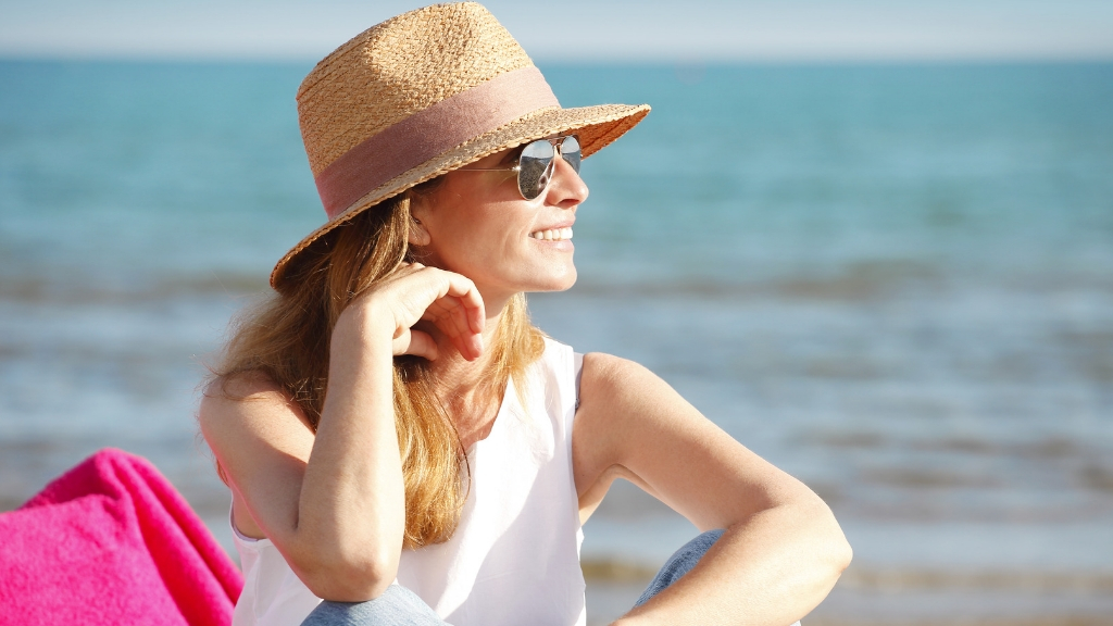 Woman enjoying a sunny beach day